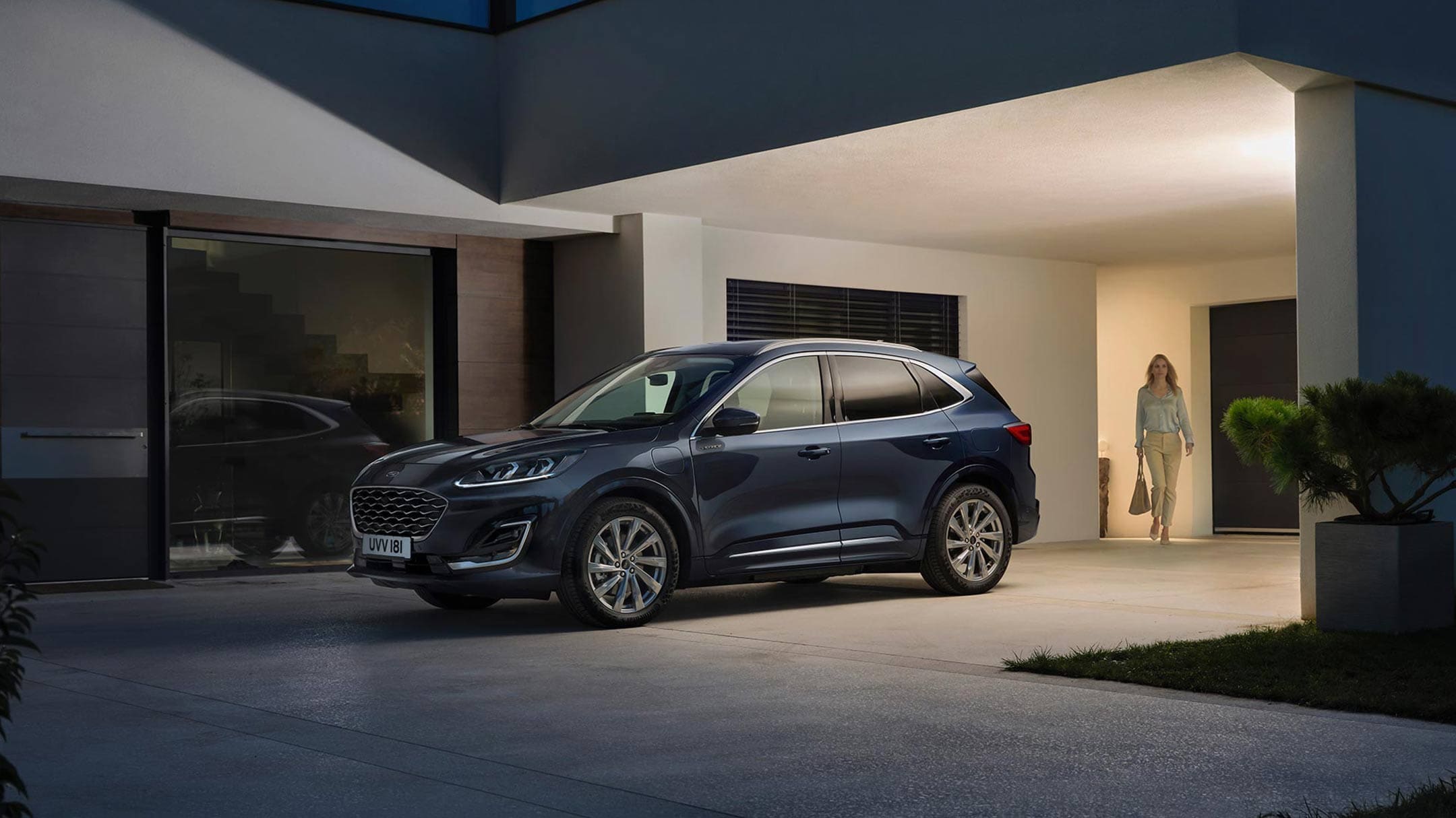 Ford Kuga Vignale PHEV in front of the house