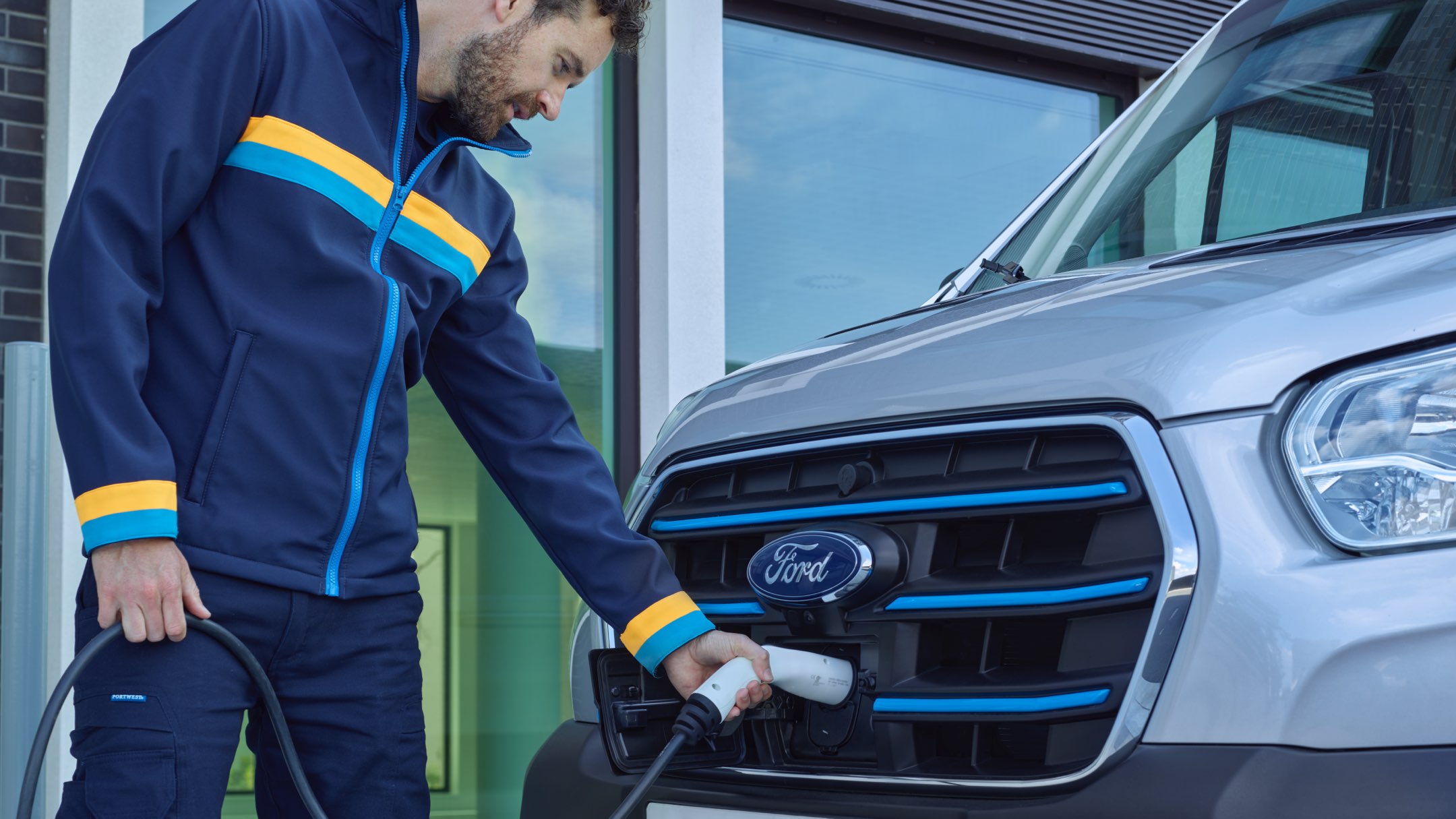 Man charging a Ford car