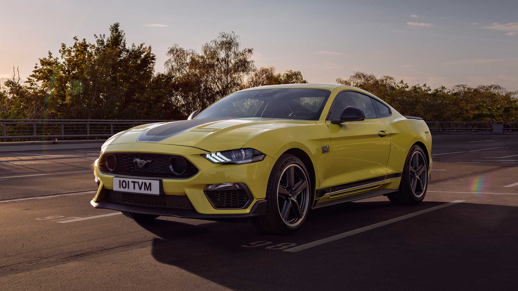 Yellow Ford Mustang on a road