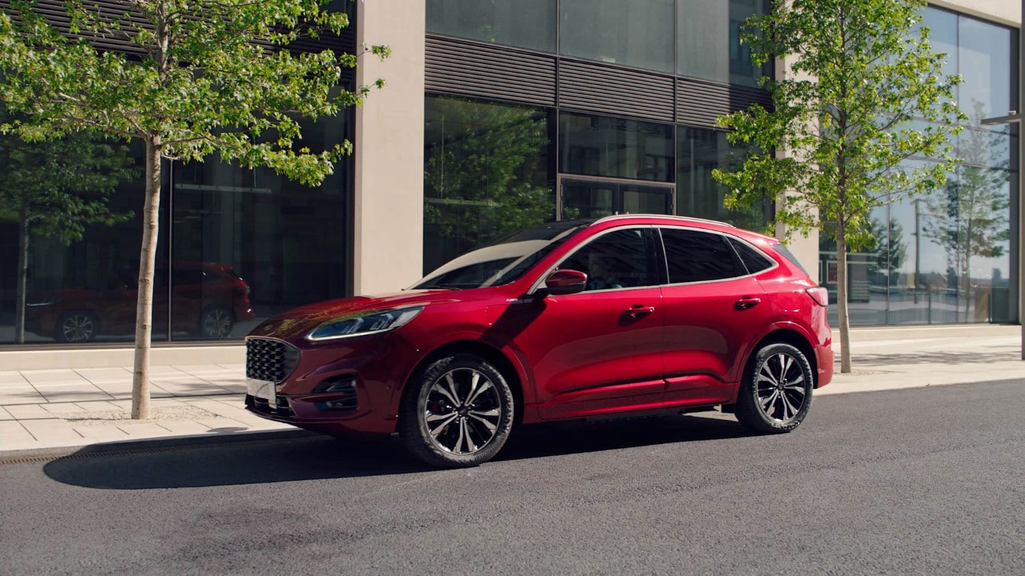 Red Ford Kuga charging in public