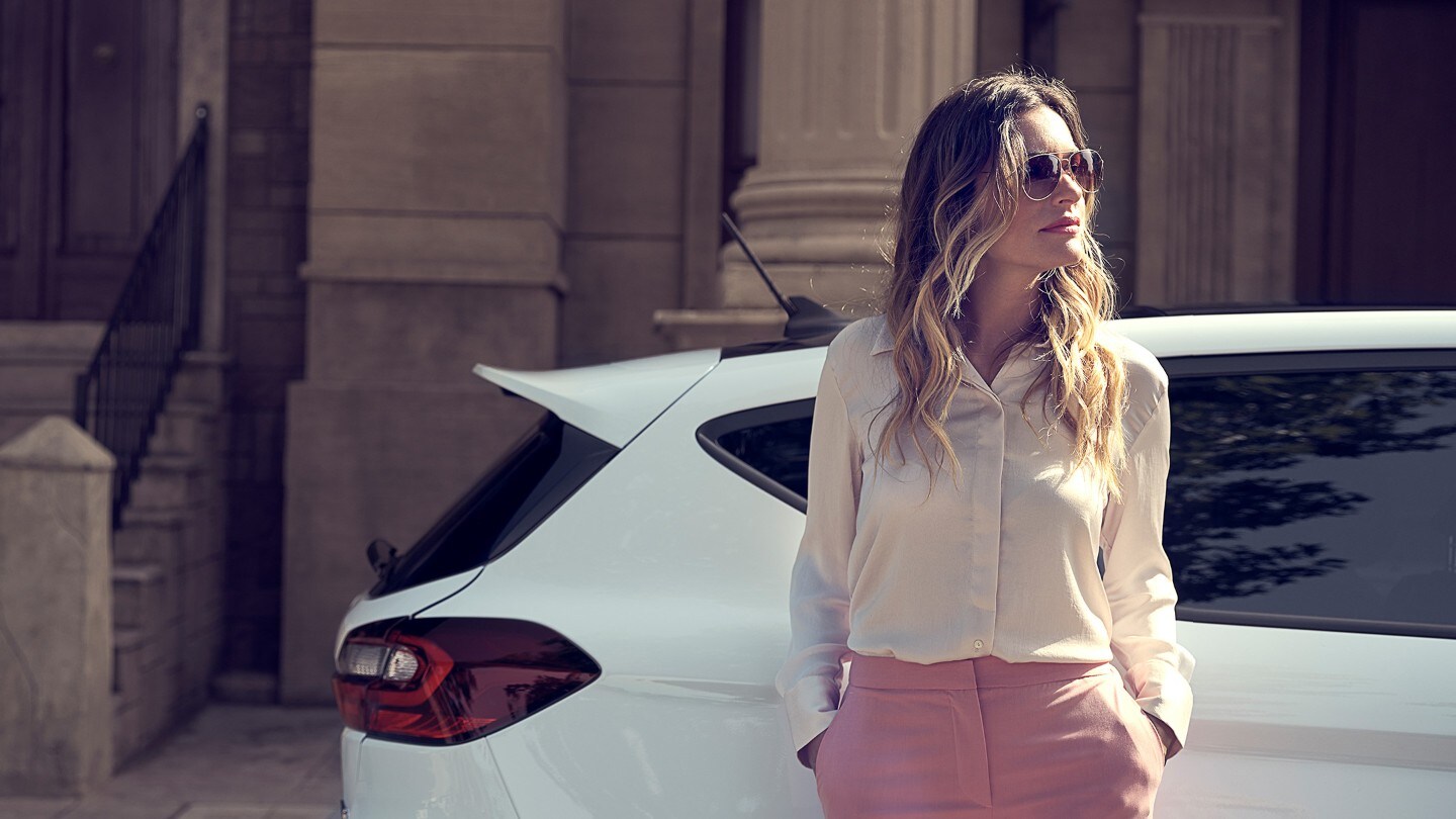 Woman in front of Ford Fiesta