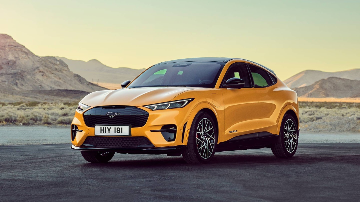 New Ford Mustang Mach-E GT, lake and mountains in the background