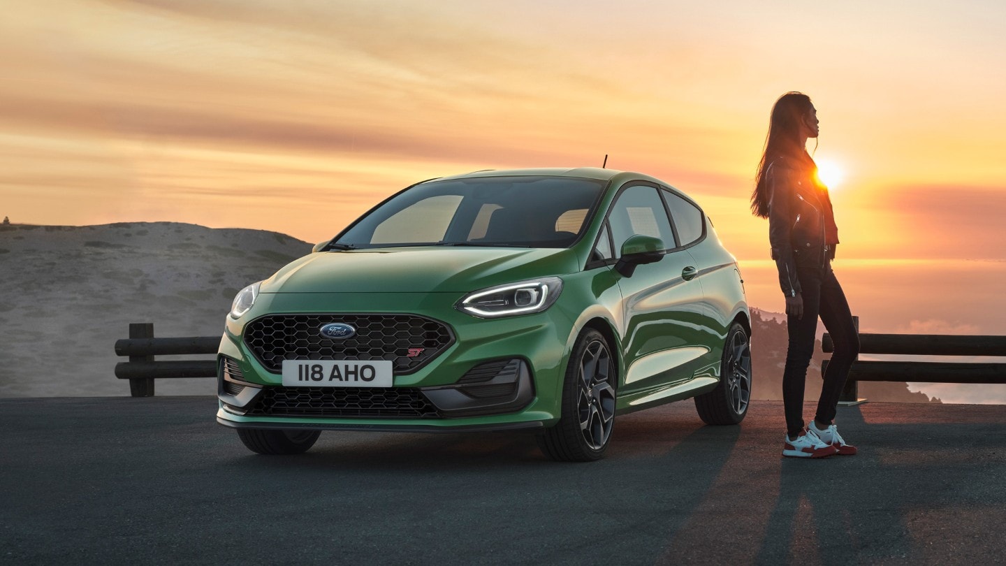 Green Fiesta ST parked by sunset