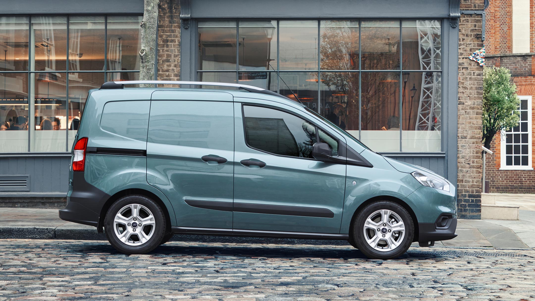 New Ford Transit Courier parked on cobbled street