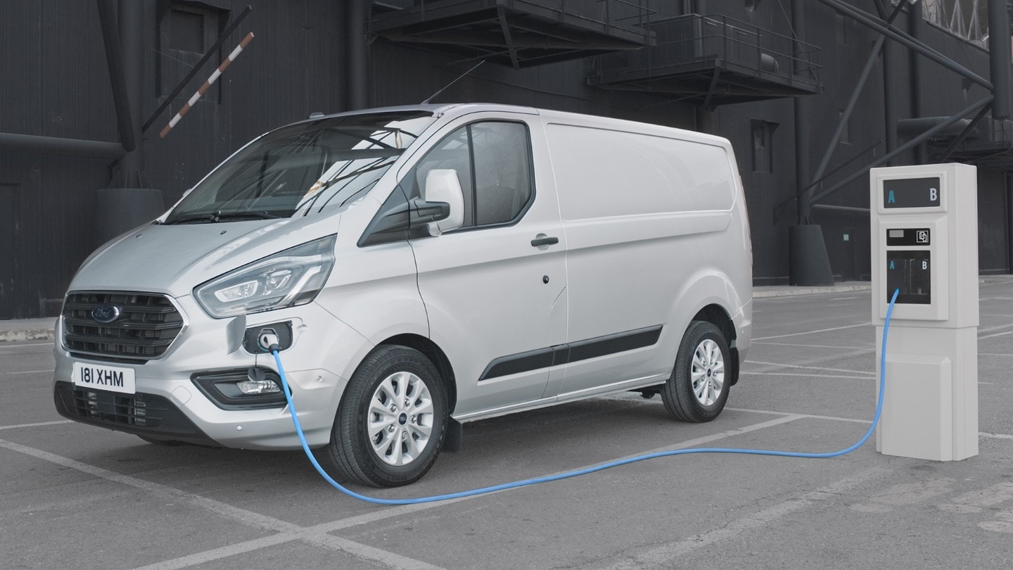 Transit Custom Van parked next to wooden wall