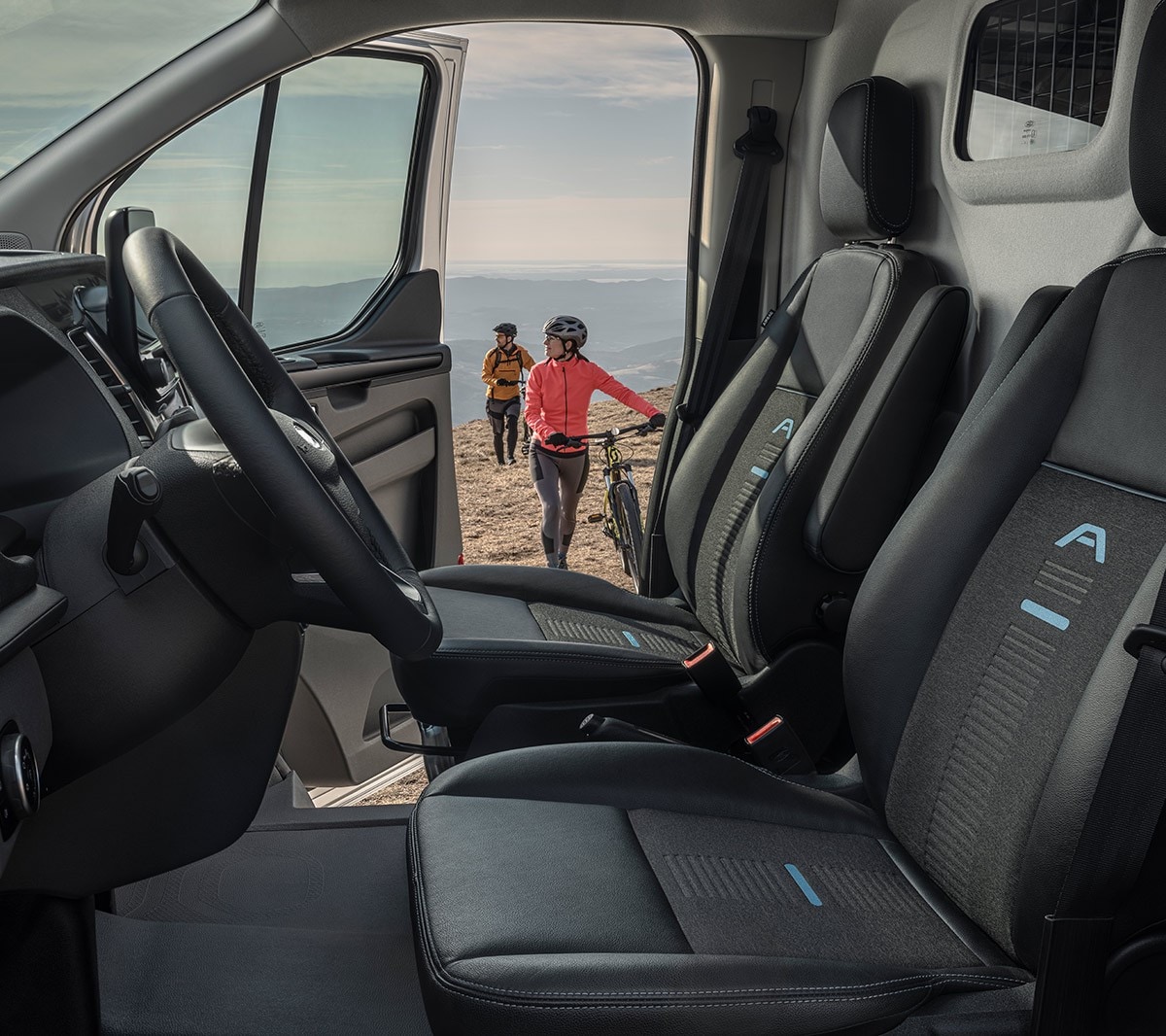 Ford Transit Custom Active inside view with door open and two cyclists walking