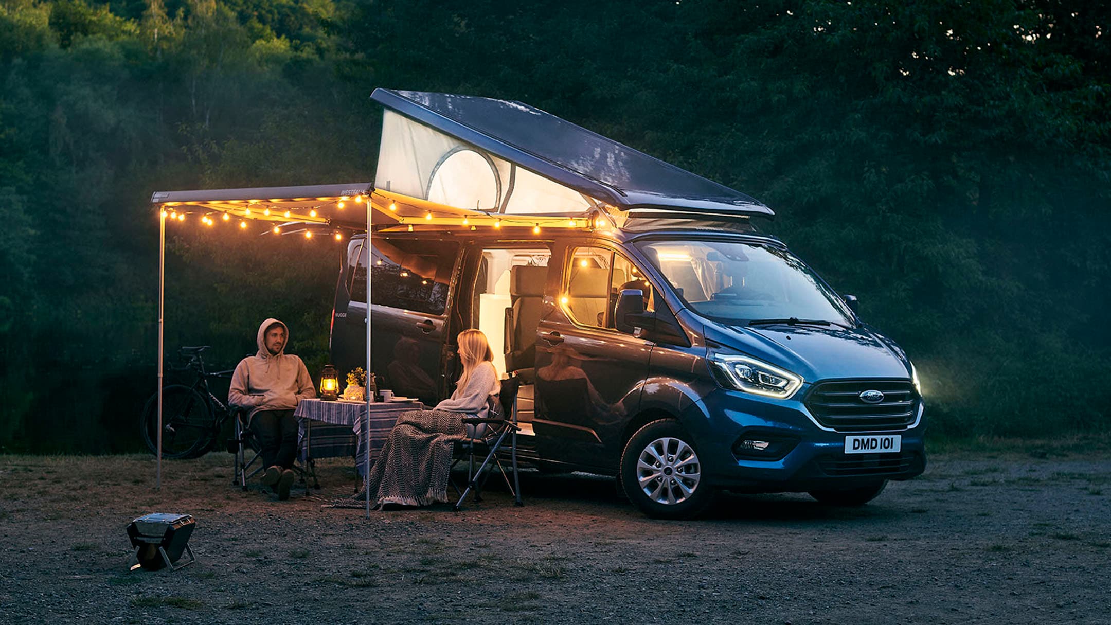 New Grey Ford Transit Custom Nugget Plus front three quarter view with canopy up