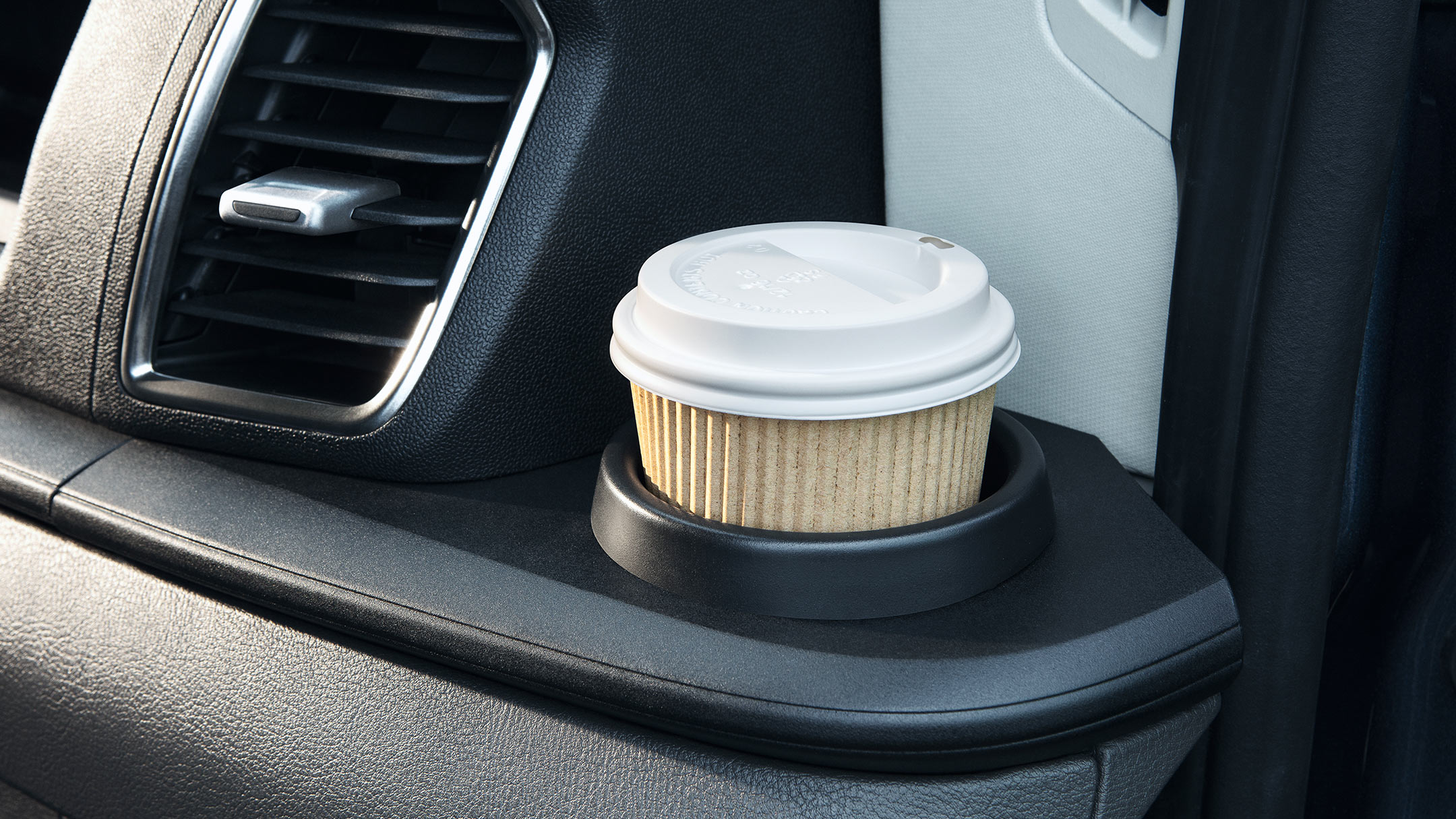 New Ford Transit Minibus interior showing coffee cup and stowage space
