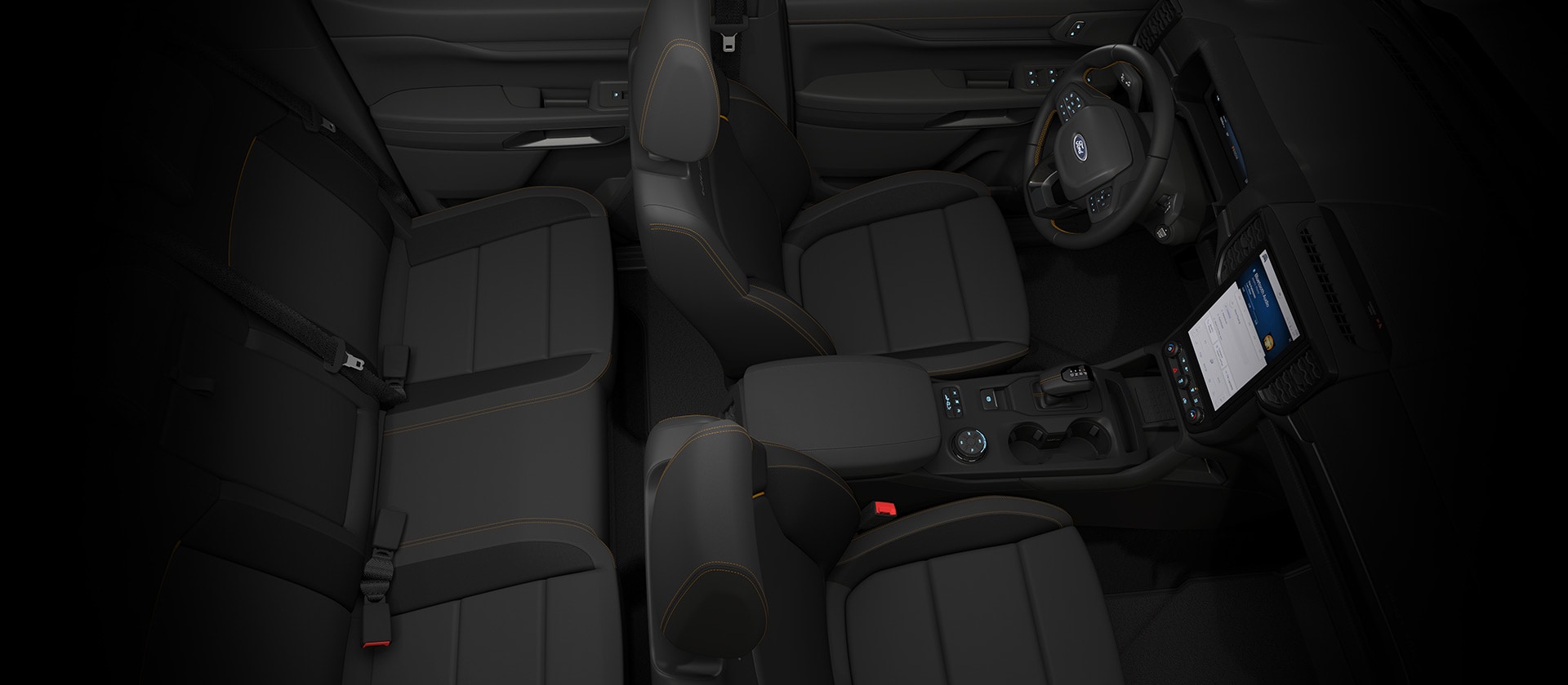 Widok z góry na wnętrze Forda Ranger z podwójną kabiną z widoczną deską rozdzielczą.