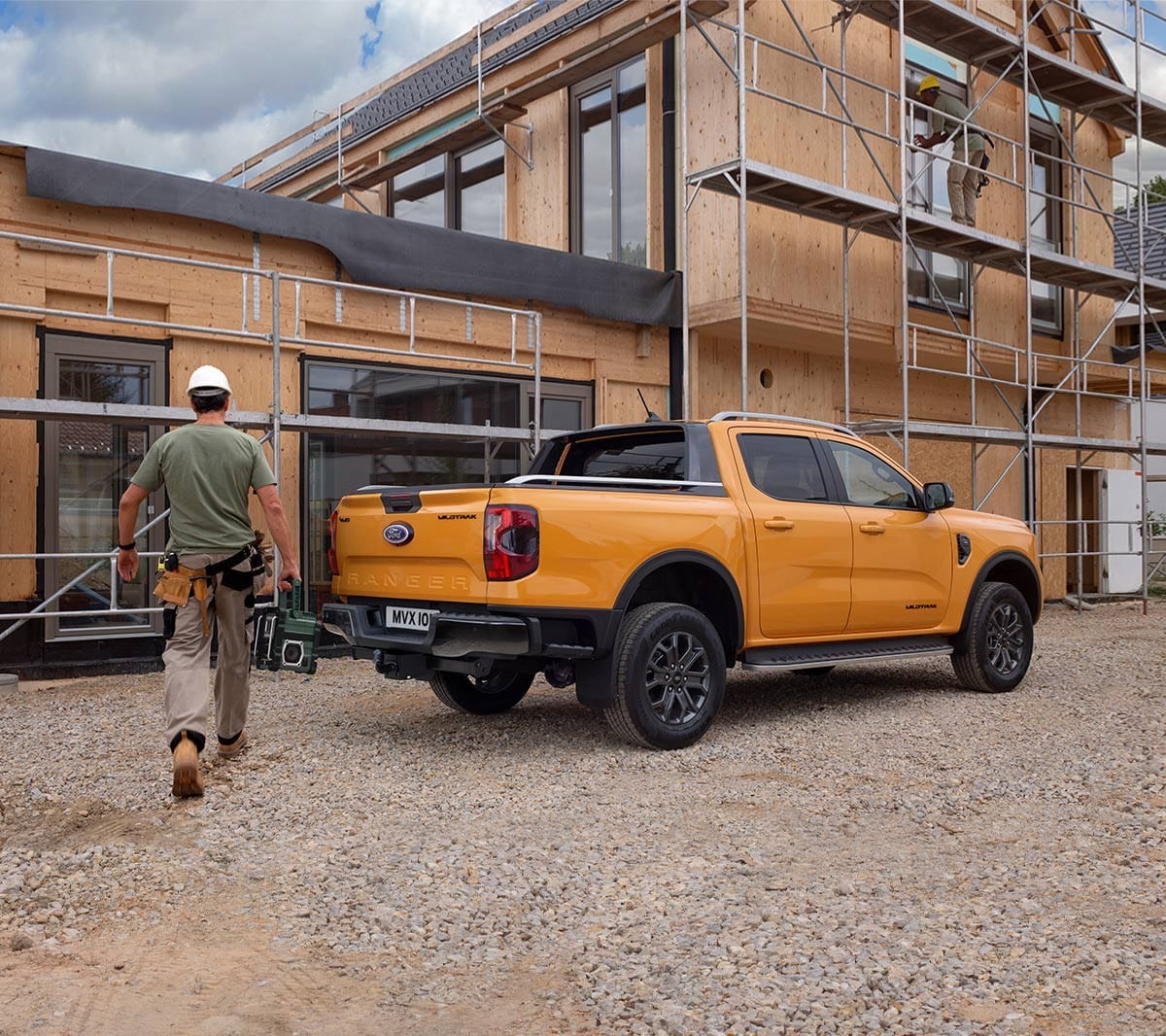 All-New Ford Ranger Wildtrak parked by construction 3/4 rear view