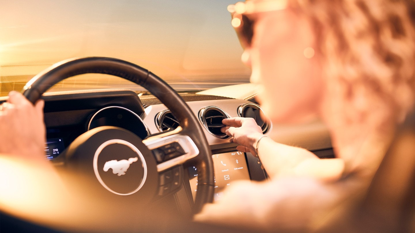 A woman driving her Mustang